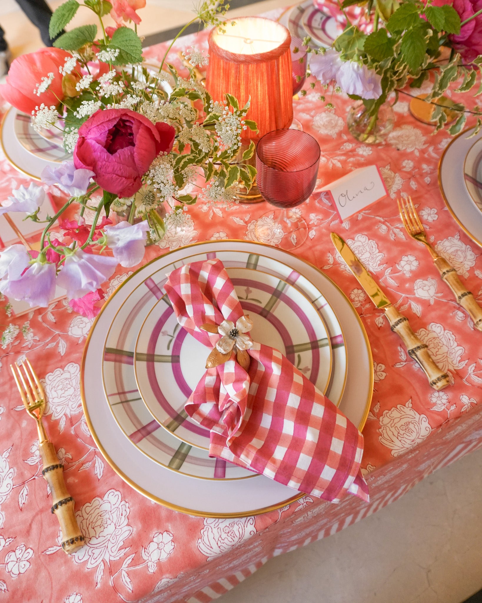Floral coral tablescape with peonies